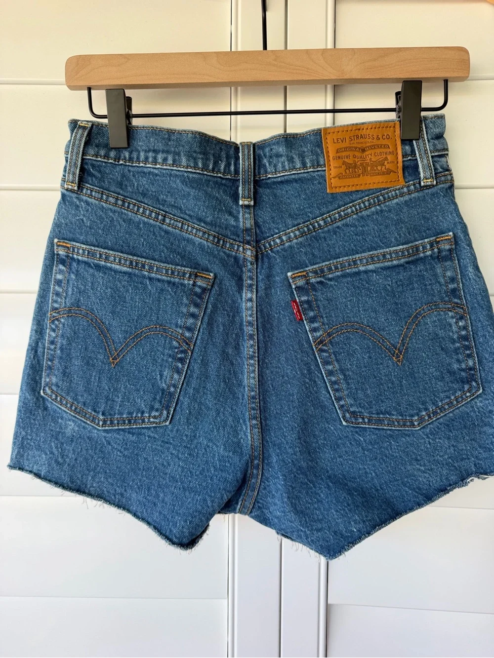 Levi's Blue Denim Asymmetric Raw Hem Jean Shorts